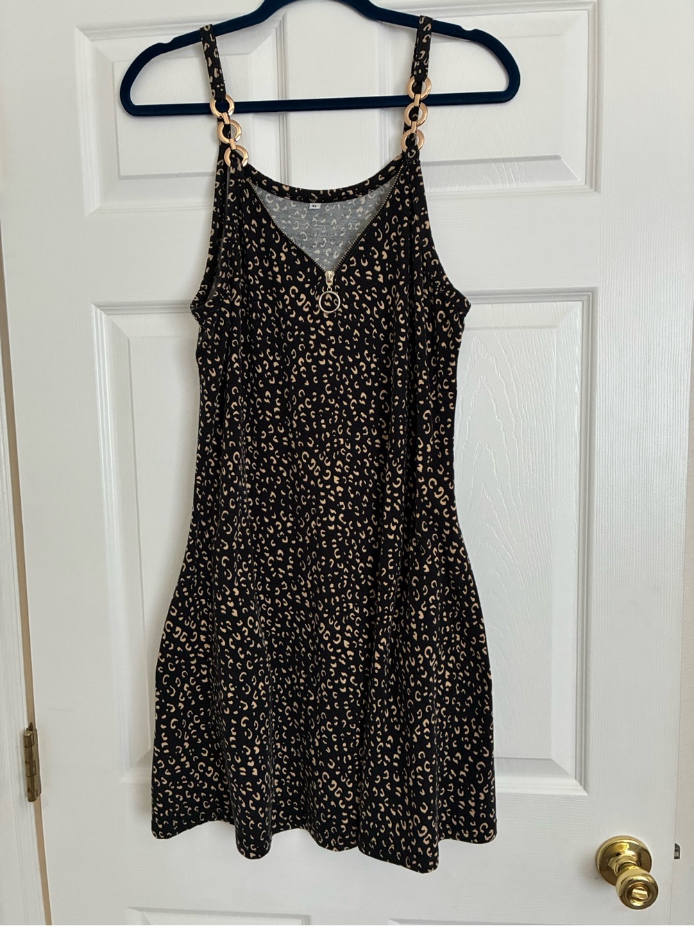Sleeveless Black & Tan Leopard Print Chain-Accent Dress with Pockets.